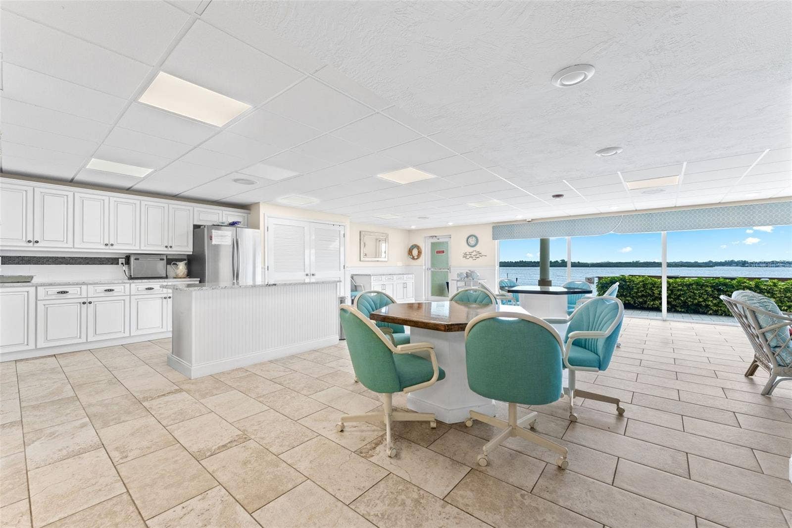 3606 S PENINSULA DRIVE, #102, Port Orange, FL 32127 Resident's kitchen with floor to ceiling views.