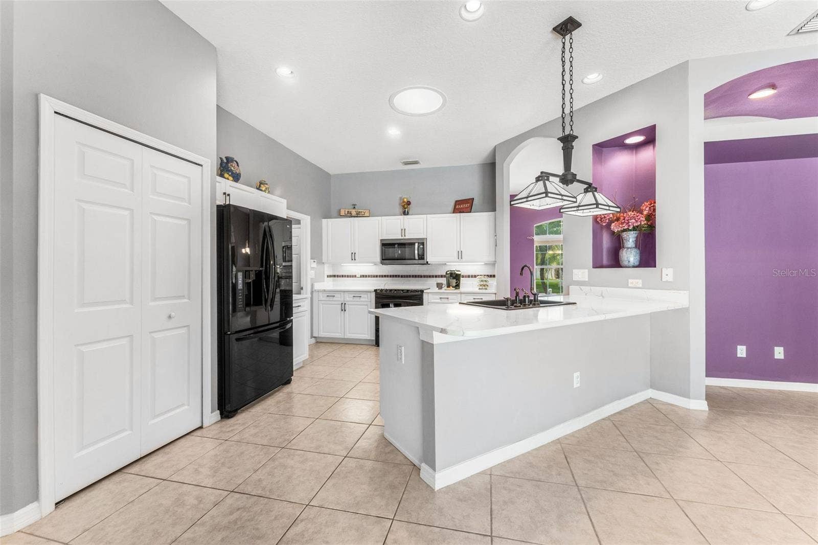 Breakfast nook area to kitchen.