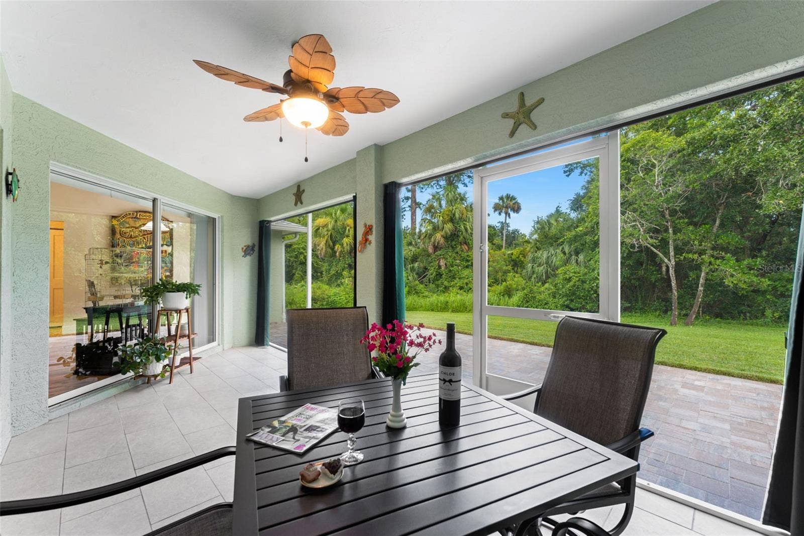 Screened lanai for dining alfresco.
