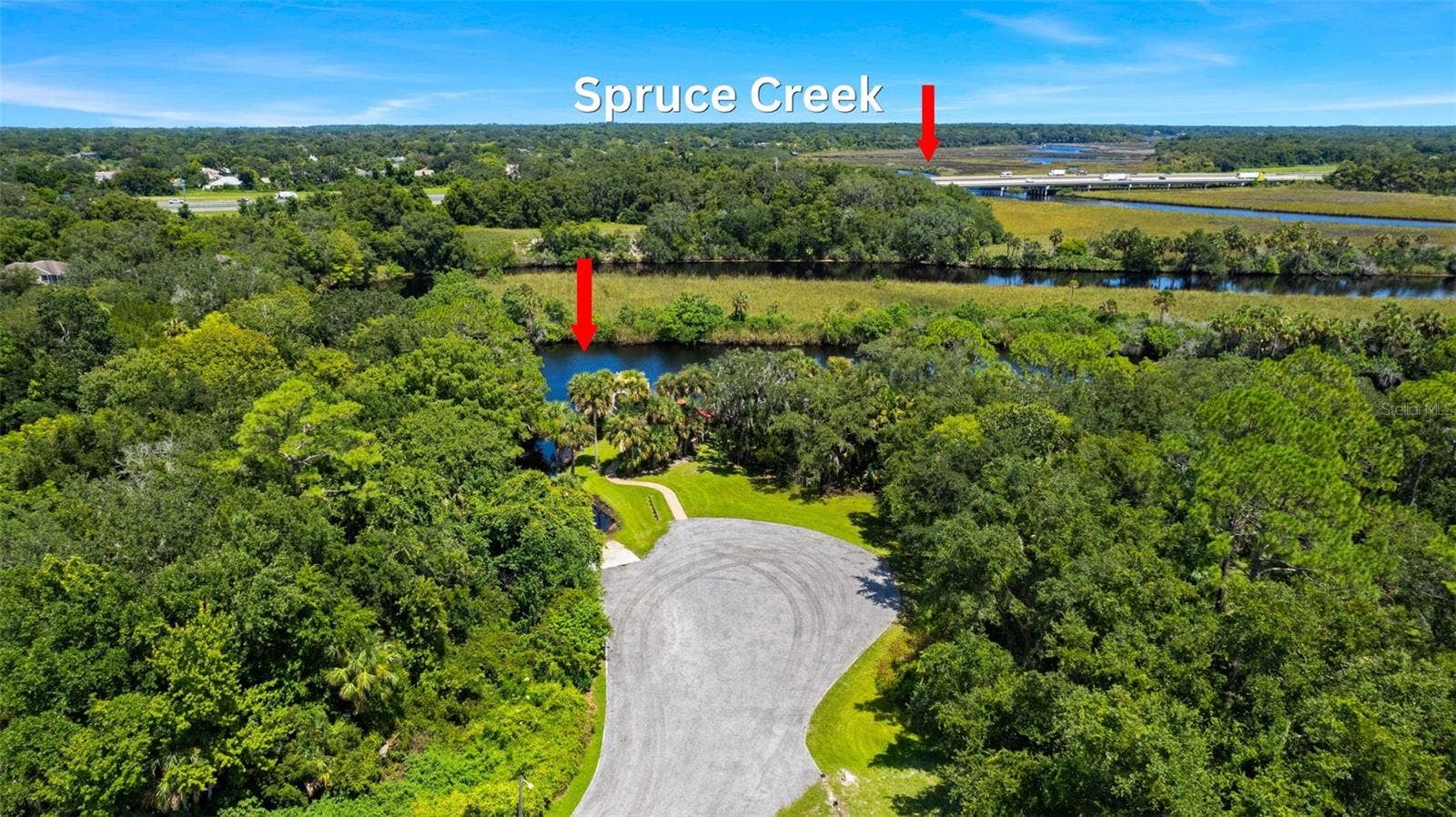 View to the south over boat ramp/dock area and Spruce Creek.