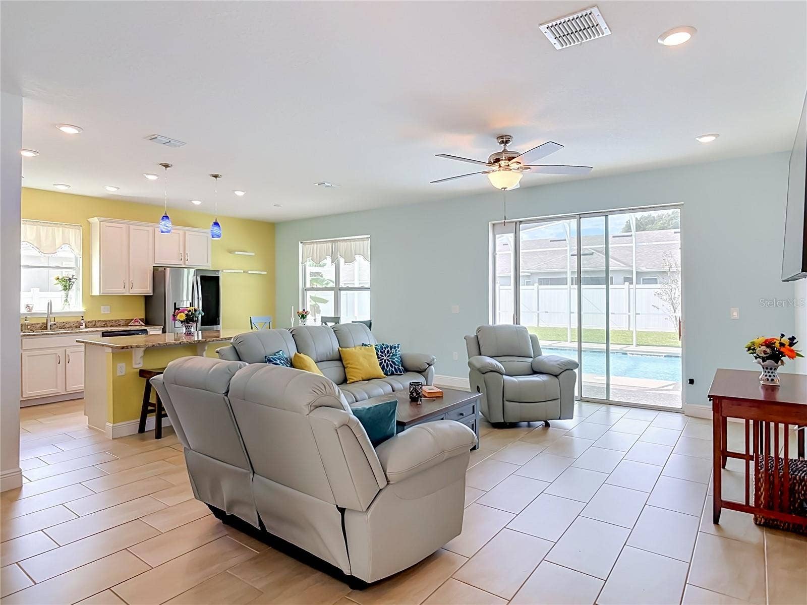 Living room sliders to lanai and pool with pet door