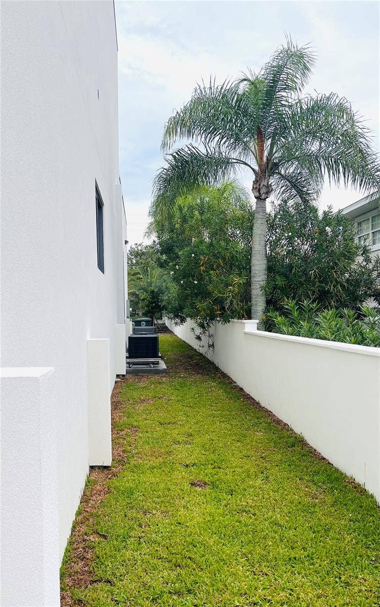 2115 N HALIFAX AVENUE, Daytona Beach, FL 32118 SOUTH SIDE WITH SURROUNDING WALL