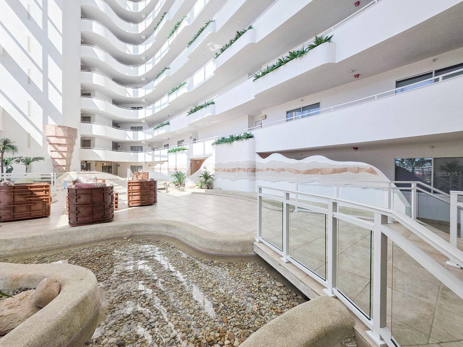 2545 S ATLANTIC AVENUE, #403, Daytona Beach Shores, FL 32118 Lobby with waterfalls, streams and little bridges flowing throughout.