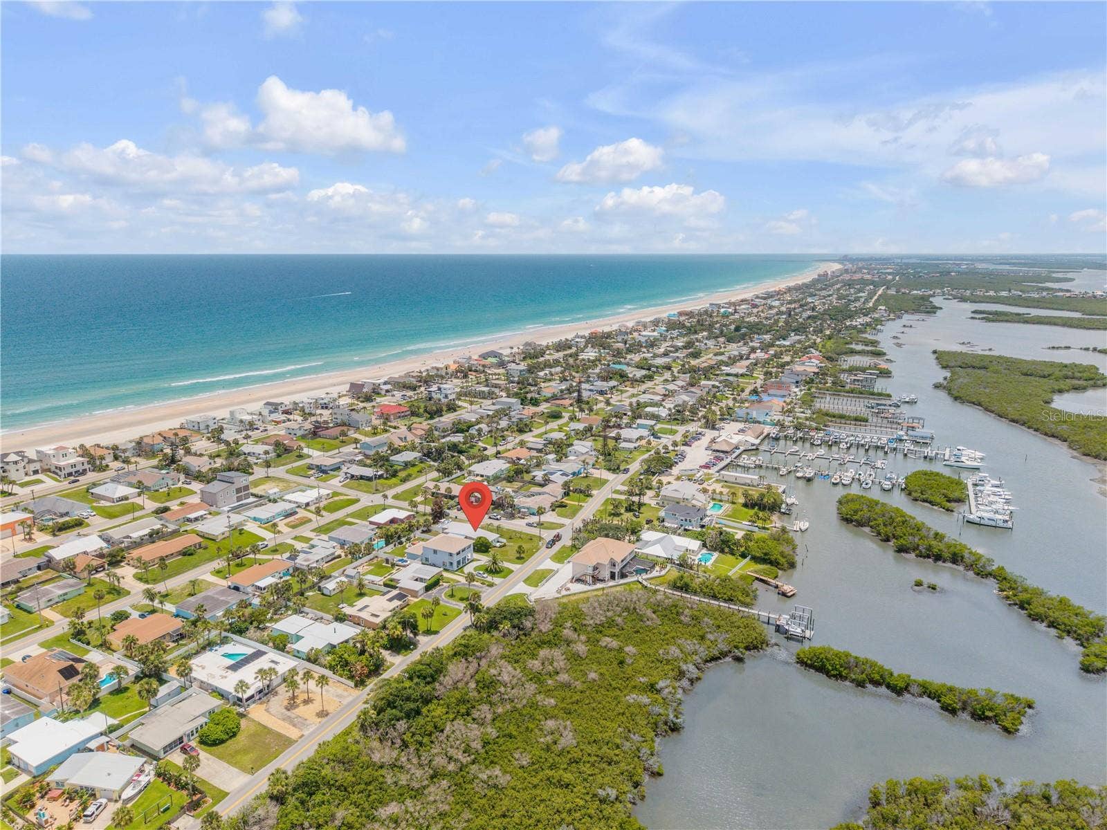 3929 S PENINSULA DRIVE, Port Orange, FL 32127 Coastal aerial showing the Atlantic shoreline and surrounding community.