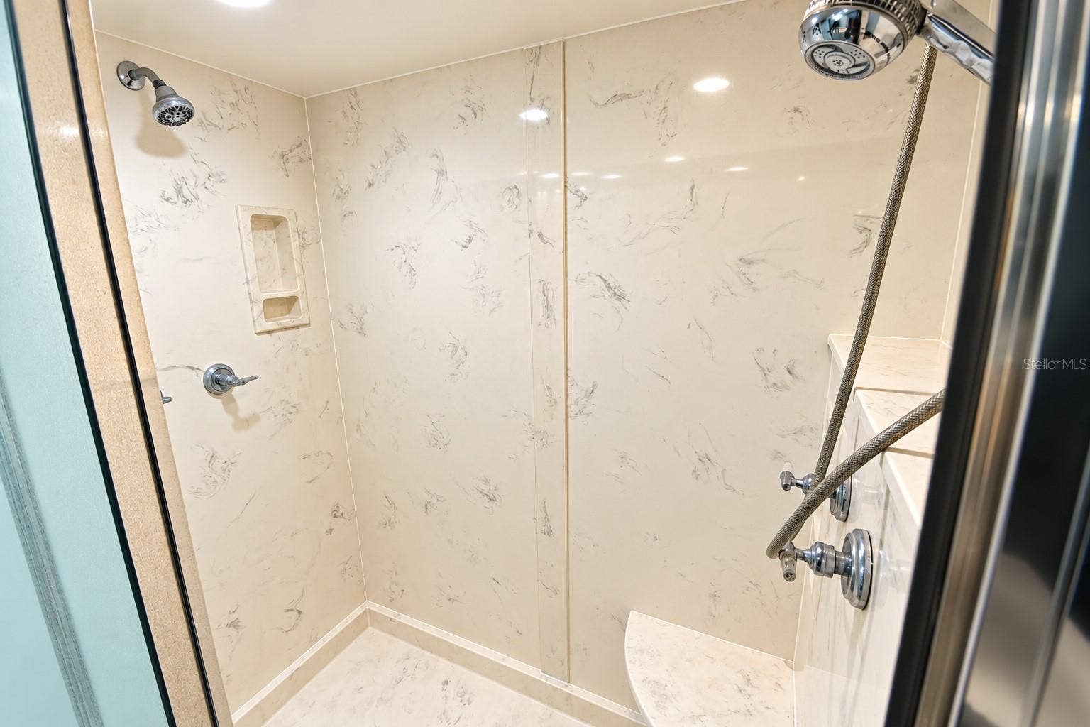 5207 S ATLANTIC AVENUE, #1126, New Smyrna Beach, FL 32169 Walk in shower with multiple shower heads.