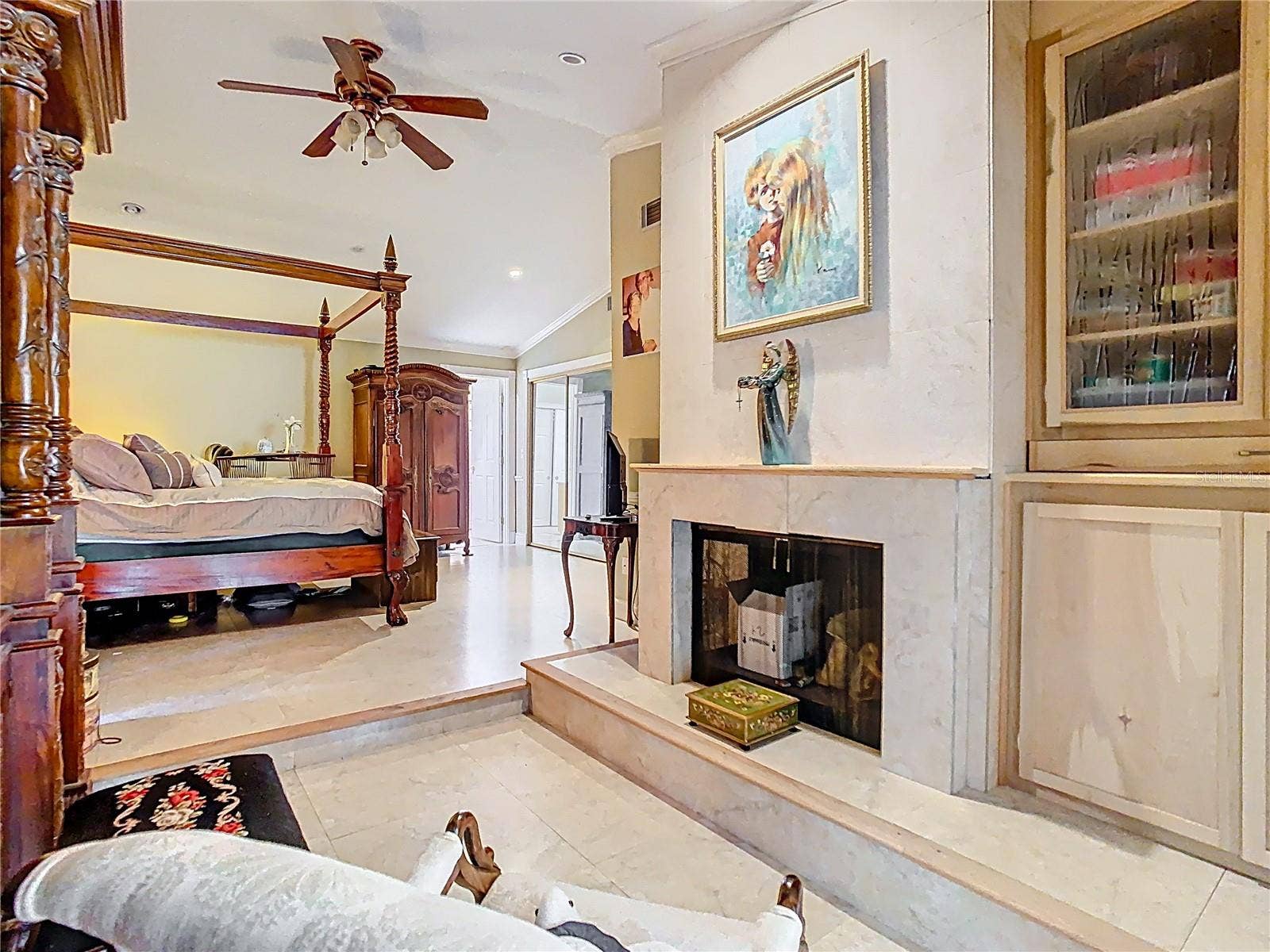 5852 MEDINAH WAY, Orlando, FL 32819 Primary Bedroom w/view of Fireplace