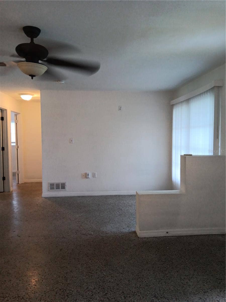 2103 MANTILLA AVENUE, Orlando, FL 32811 View of living room and dining area