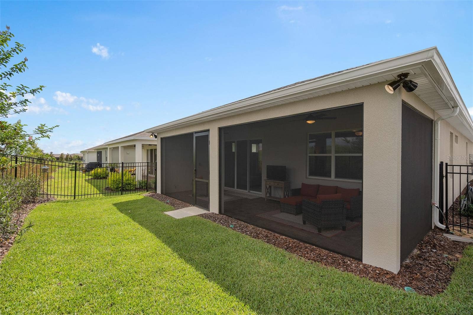 2759 PURPLE MEADOW COURT, Minneola, FL 34715 Rear View with an Irrigated Fenced Back Yard. There are gates on both sides for your convenience.