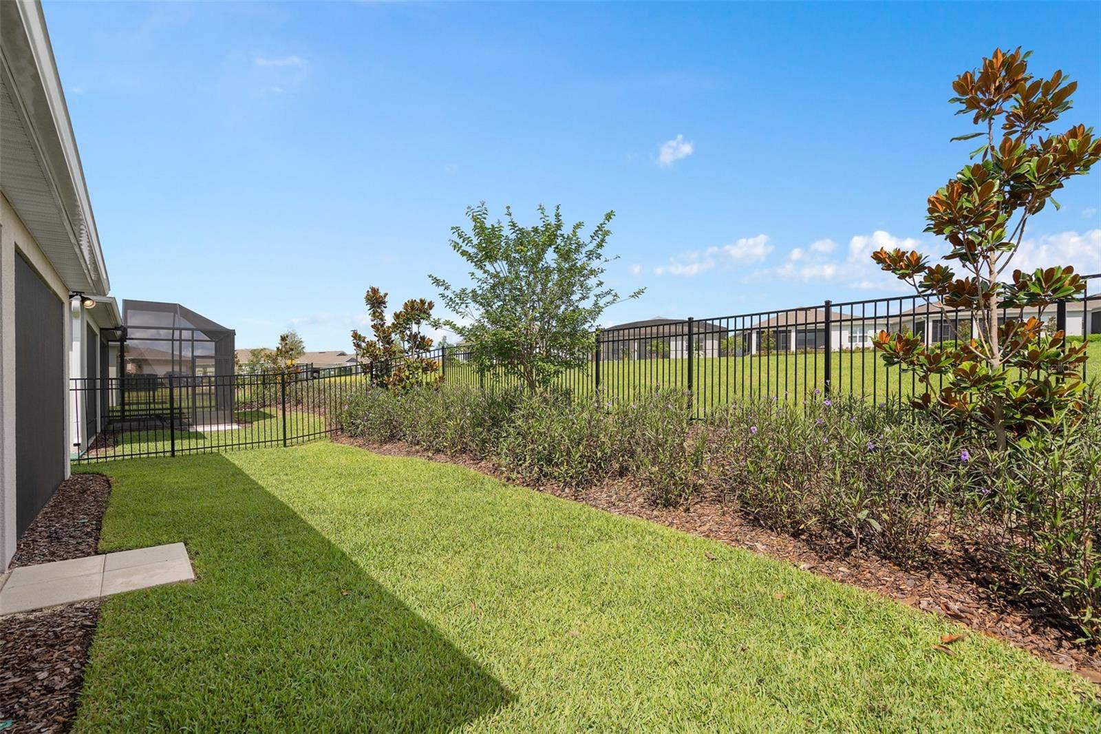 2759 PURPLE MEADOW COURT, Minneola, FL 34715 Fenced Rear Yard with Lawn and Planting Area Irrigation.