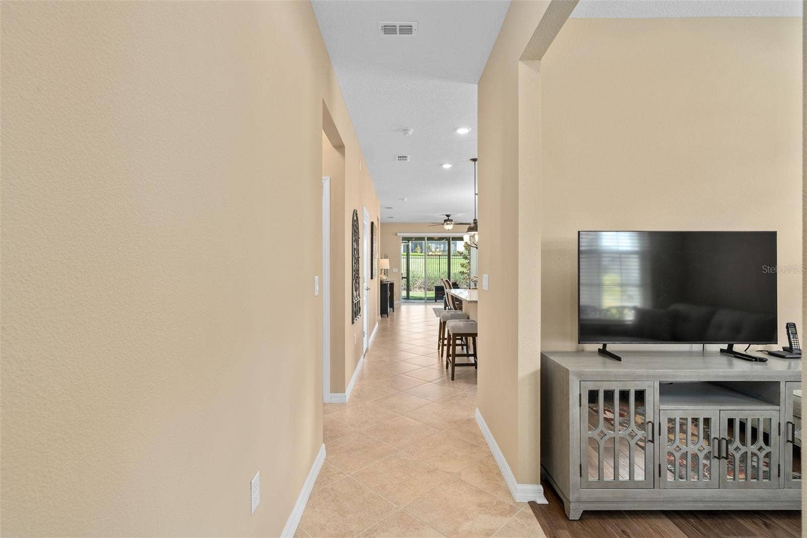 2759 PURPLE MEADOW COURT, Minneola, FL 34715 Upon entry, You will have a see through view to the Lanai. The Office/Den/Study is on the right.