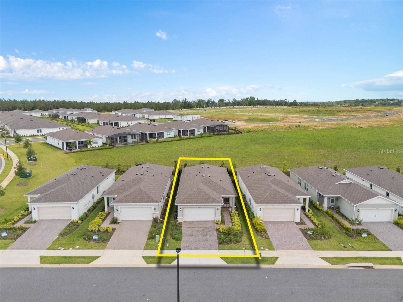 2759 PURPLE MEADOW COURT, Minneola, FL 34715 Elevated Front View. Please take note of the green space at the rear of the home.