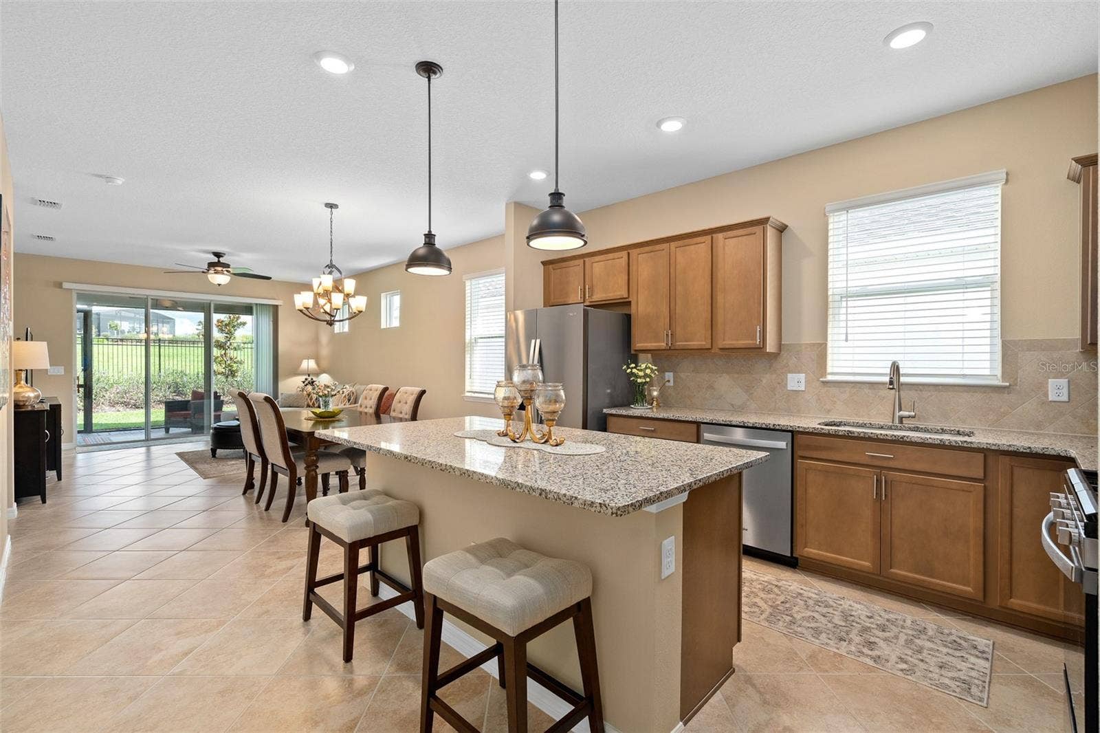 2759 PURPLE MEADOW COURT, Minneola, FL 34715 The Contour model offers a great flowing floor plan. The cabinet color in person is a much richer tone than pictured.