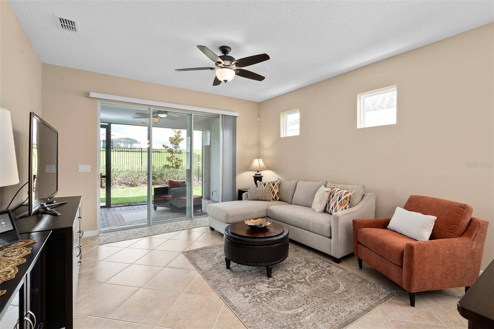2759 PURPLE MEADOW COURT, Minneola, FL 34715 Family Room with a view to the open green space area in the rear of the home.
