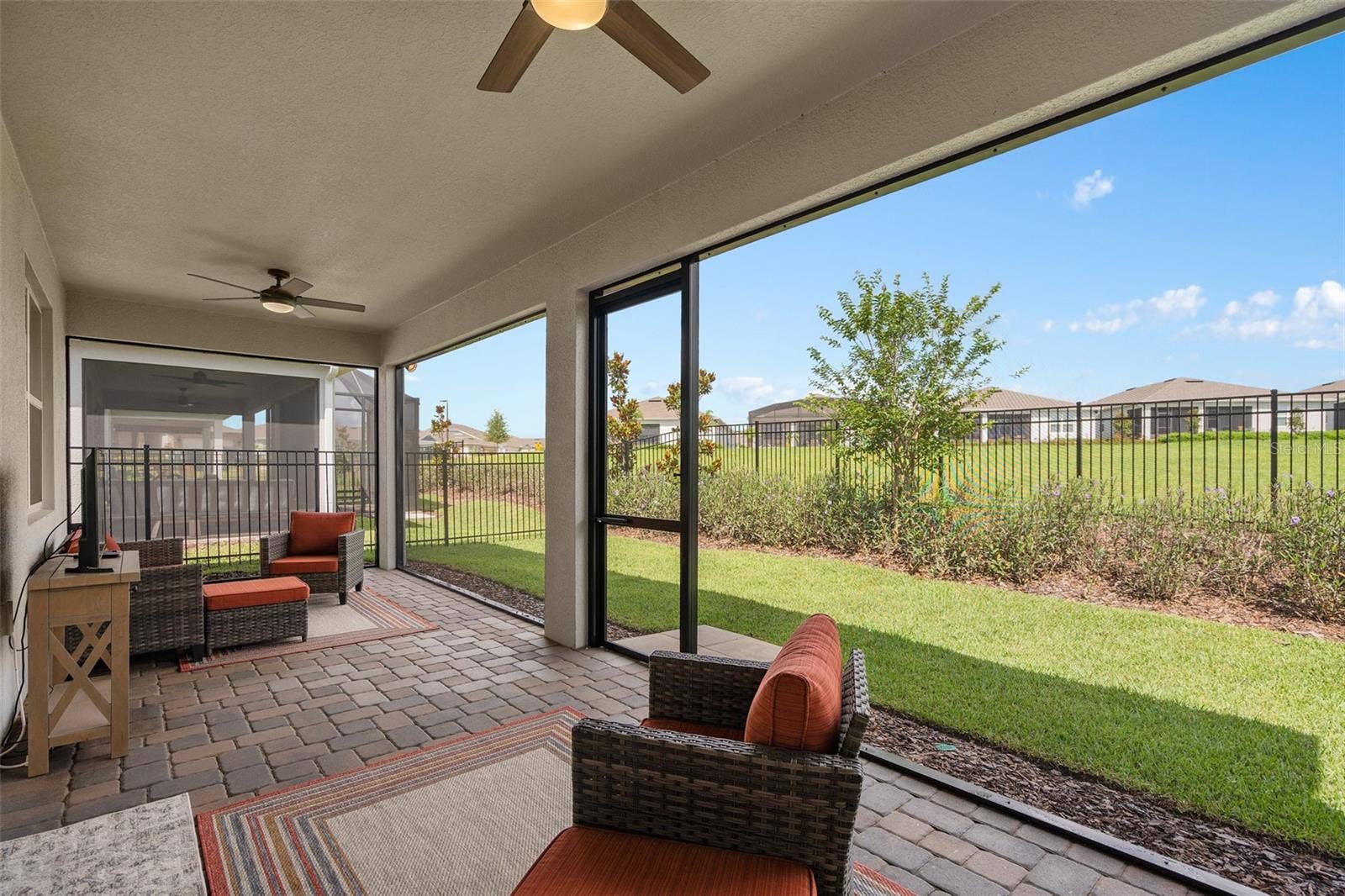 2759 PURPLE MEADOW COURT, Minneola, FL 34715 Enjoy the Open Green Space while Relaxing in the Extended Under Roof and Picture Screened Lanai with Pavers. Additional features are TV Connections, Pre-Plumed for an Outdoor Kitchen and a Water Spigot for the ease of cleaning.