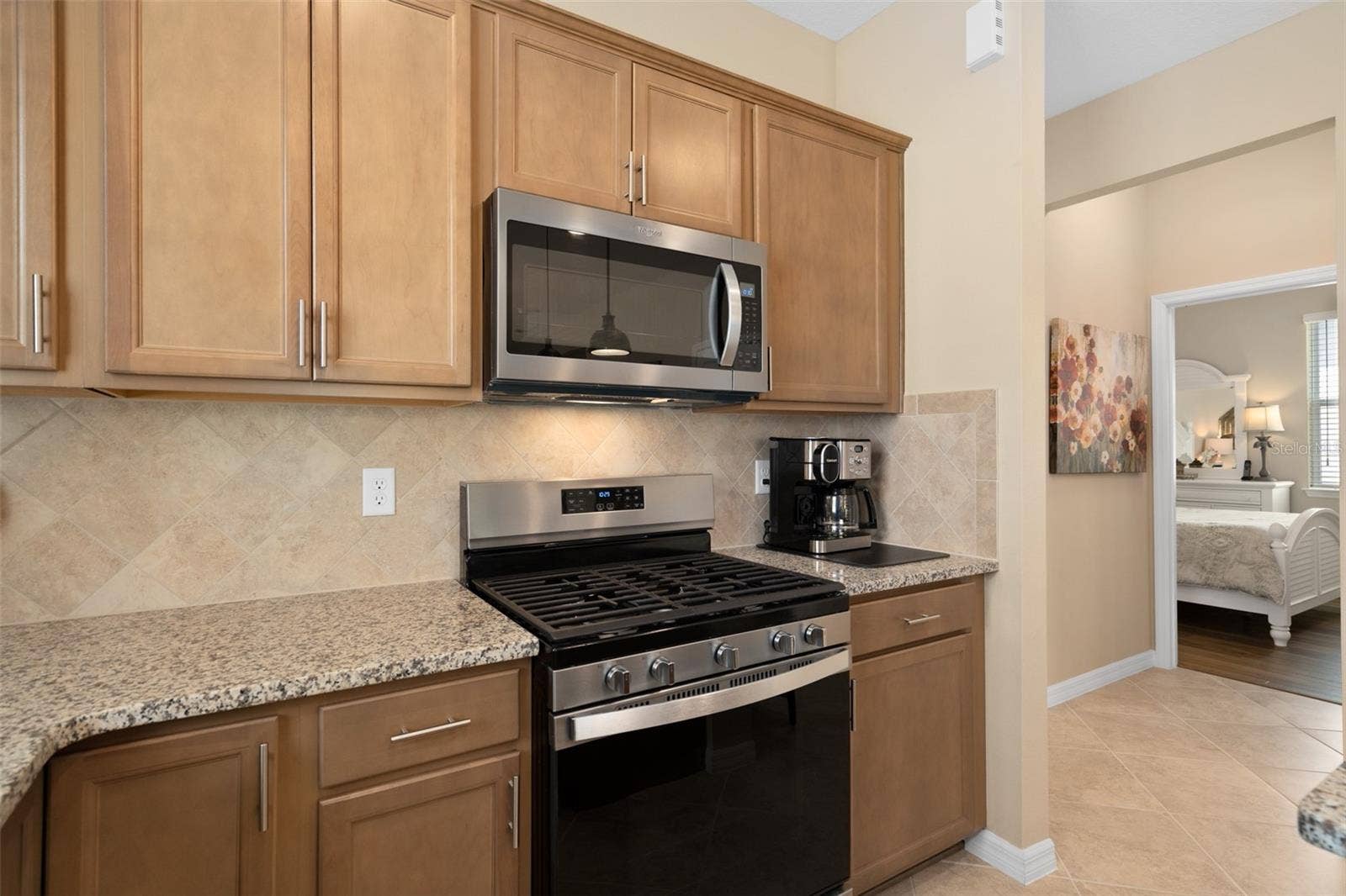 2759 PURPLE MEADOW COURT, Minneola, FL 34715 The Backsplash is installed on a Diagonal and the Microwave is Vented to the Exterior.