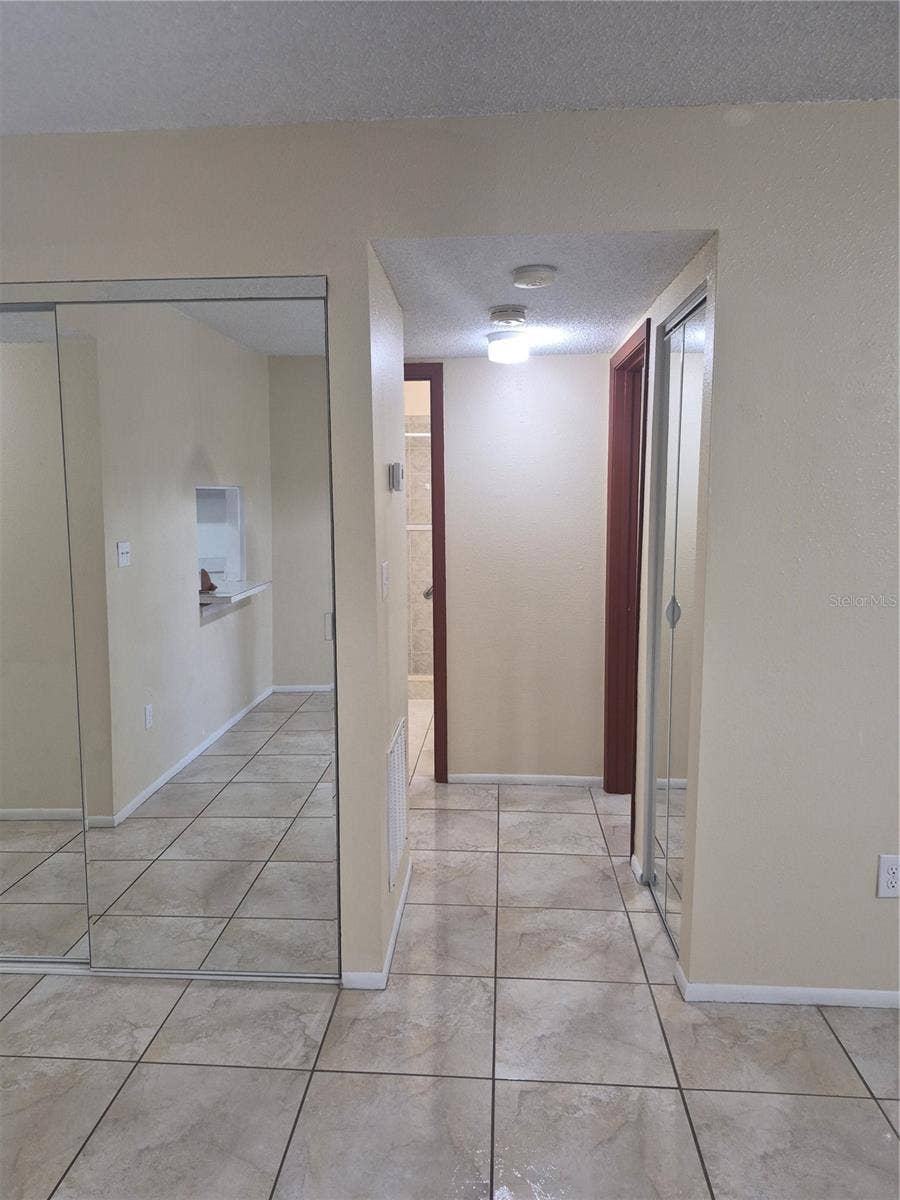 2806 N POWERS DRIVE, #8, Orlando, FL 32818 View from dining to bedrooms and bathroom
