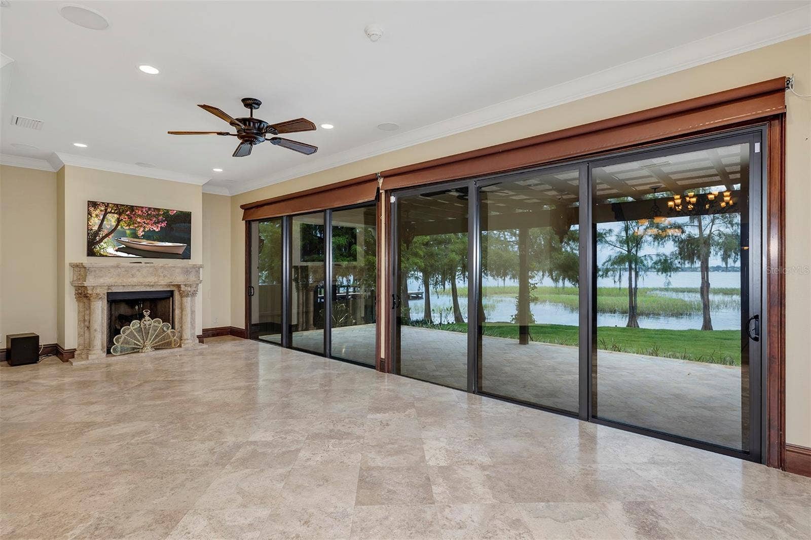 10203 TROUT ROAD, Orlando, FL 32836 Living Room w/Fireplace and view of Lake Tibet