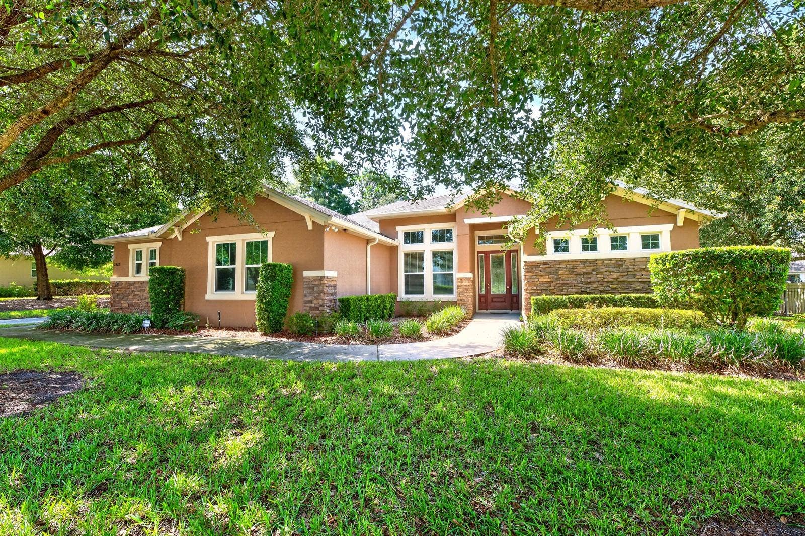 2522 TREE MEADOW LOOP, Apopka, FL 32712 Set on a beautifully landscaped 1/3 ACRE LOT (.37) in the GATED Oak Ridge community of Apopka, this spacious 4-bedroom + office, 3-bath home offers the perfect blend of flexible living spaces, timeless design, and room to grow!