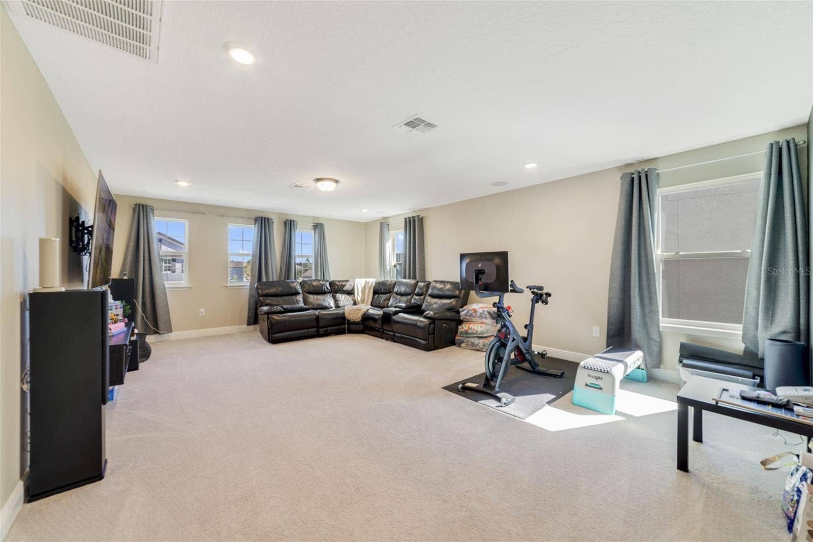 Upstairs, a GENEROUS LOFT creates a perfect secondary living area.