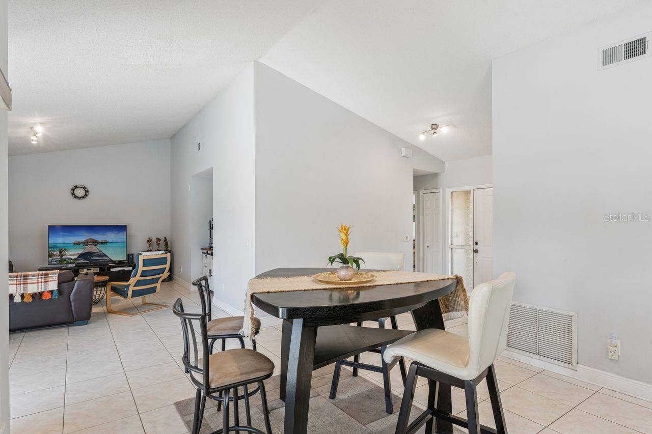 8215 ROLLA COURT, Orlando, FL 32836 View of dinette to living room area
