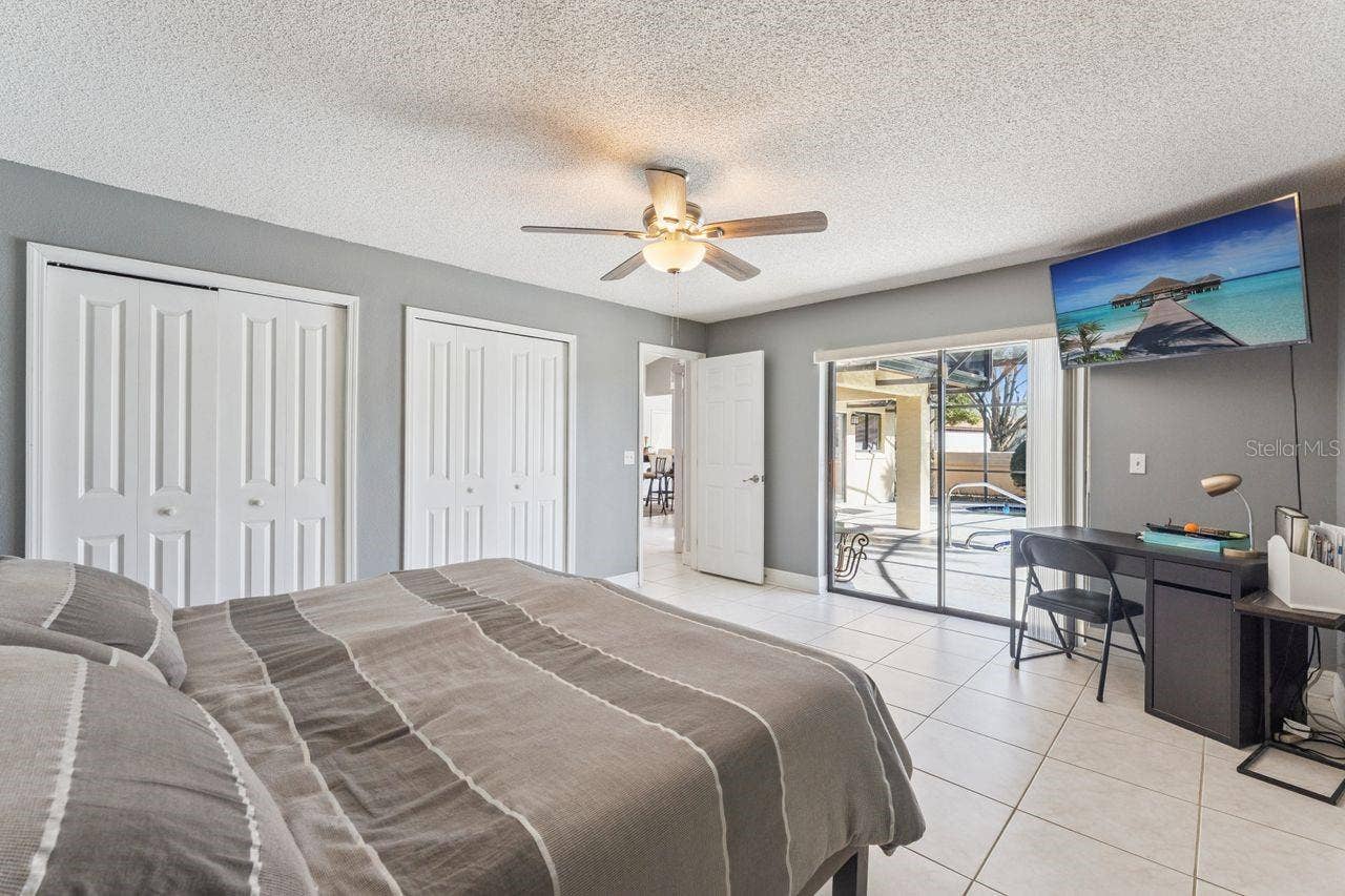 8215 ROLLA COURT, Orlando, FL 32836 Third bedroom with view of pool