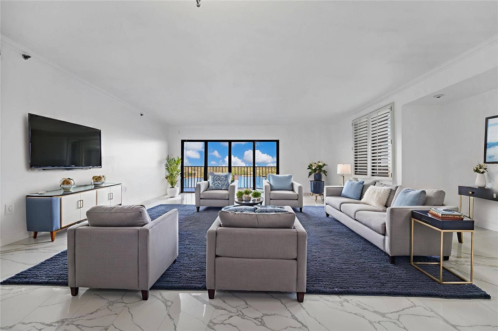 7550 HINSON STREET, #10A, Orlando, FL 32819 Living room virtual staged.
