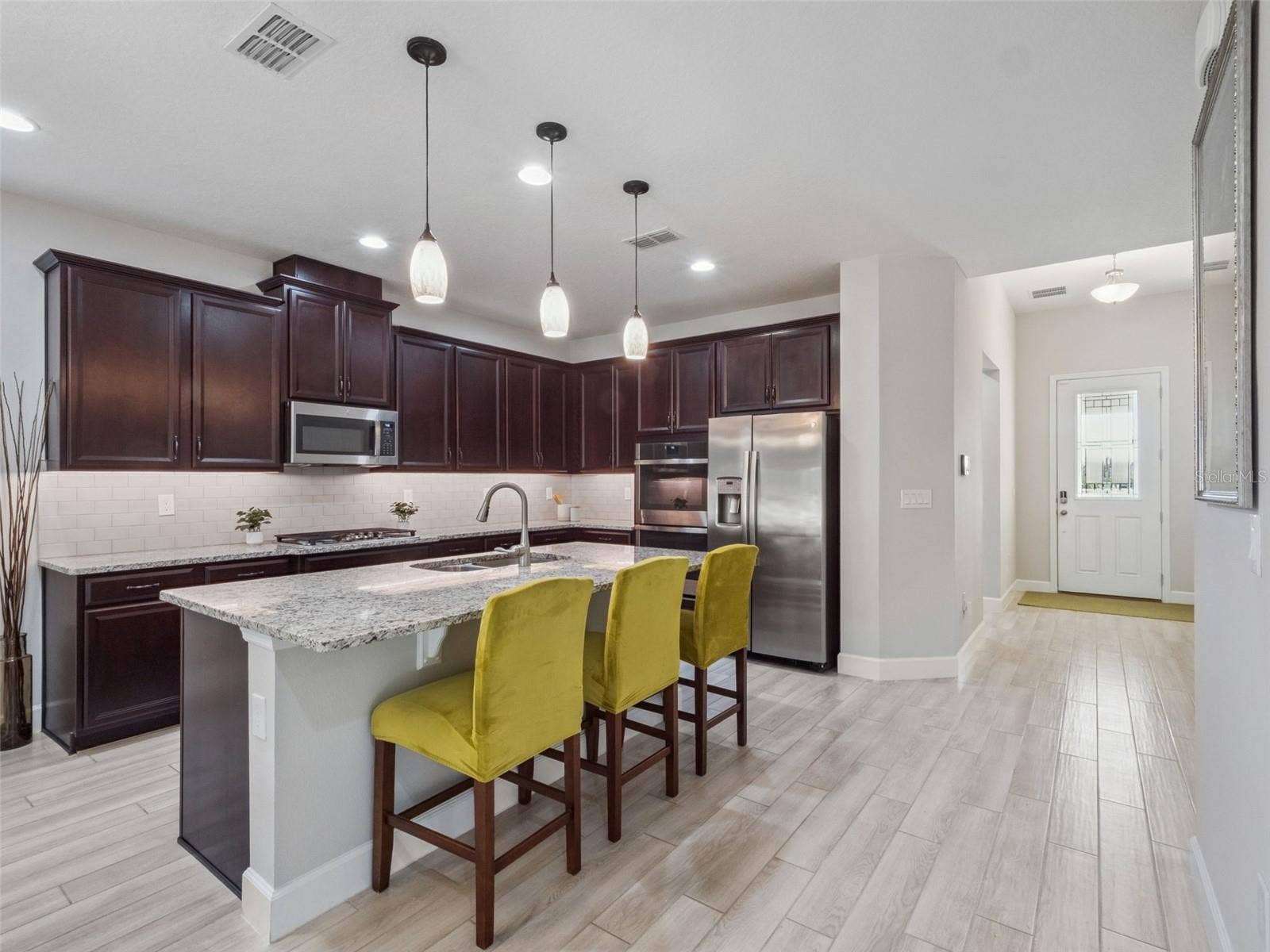 14345 WABASSO LOOP, Winter Garden, FL 34787 Kitchen towards foyer + bedroom 1