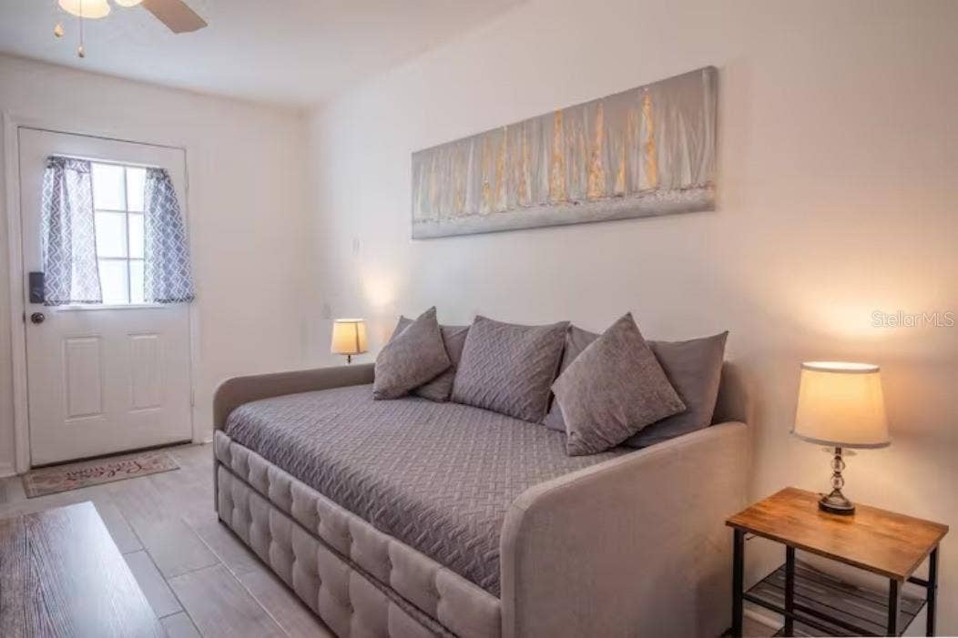 3120 PEEL AVENUE, Orlando, FL 32806 sofa bed, side table with lamp