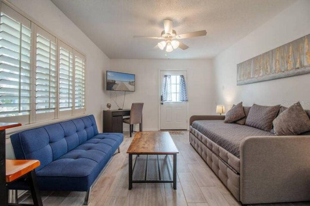 3120 PEEL AVENUE, Orlando, FL 32806 Shared living room with 2 sofa beds, tv, Laptop-friendly workspace