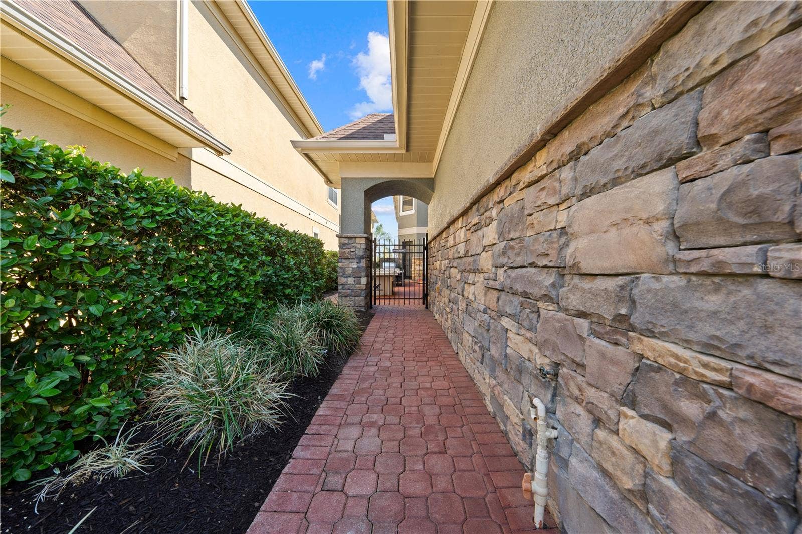 785 GOLDEN BEAR DRIVE, Reunion, FL 34747 sidewalk from driveway to courtyard