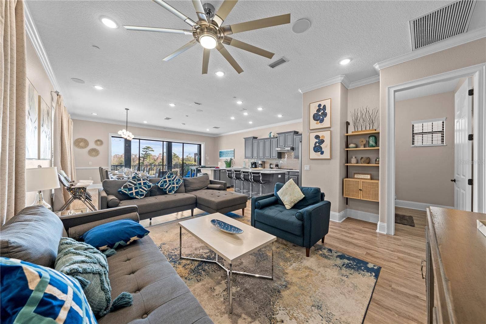 785 GOLDEN BEAR DRIVE, Reunion, FL 34747 living room with view of kitchen/dining and breakfast nook