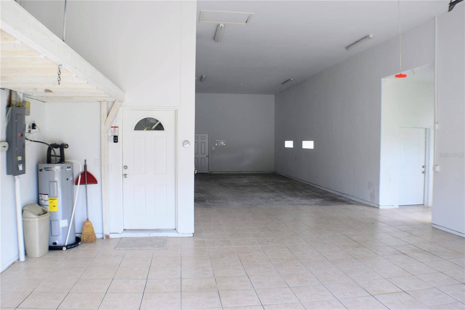 Large Garage with floored storage above.