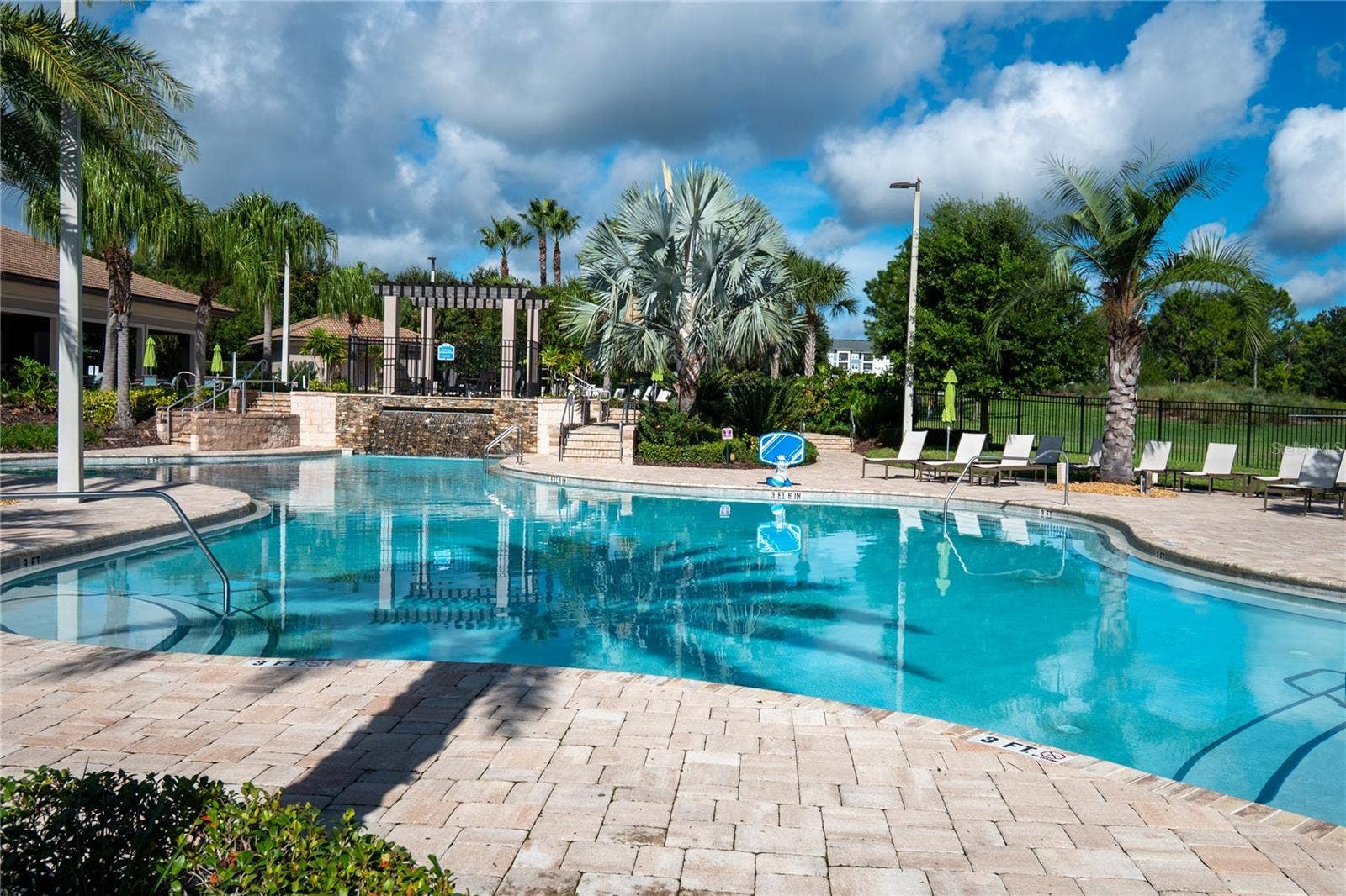 1301 GLENEAGLES LANE, Davenport, FL 33896 The Plaza - lower pool, waterfall, and loungers