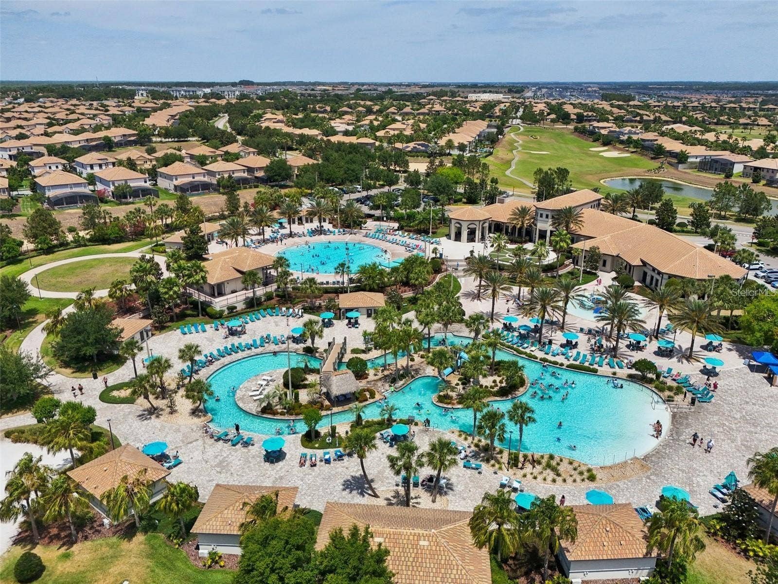 1301 GLENEAGLES LANE, Davenport, FL 33896 Oasis Club with lazy river, community pool, kids splash zone, two bars, restaurant, arcade, gym, and movie theater