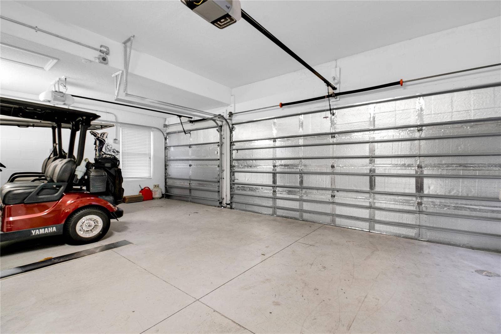 1301 GLENEAGLES LANE, Davenport, FL 33896 Climate Controlled 3 car garage with a mini-split A/C unit and insulation