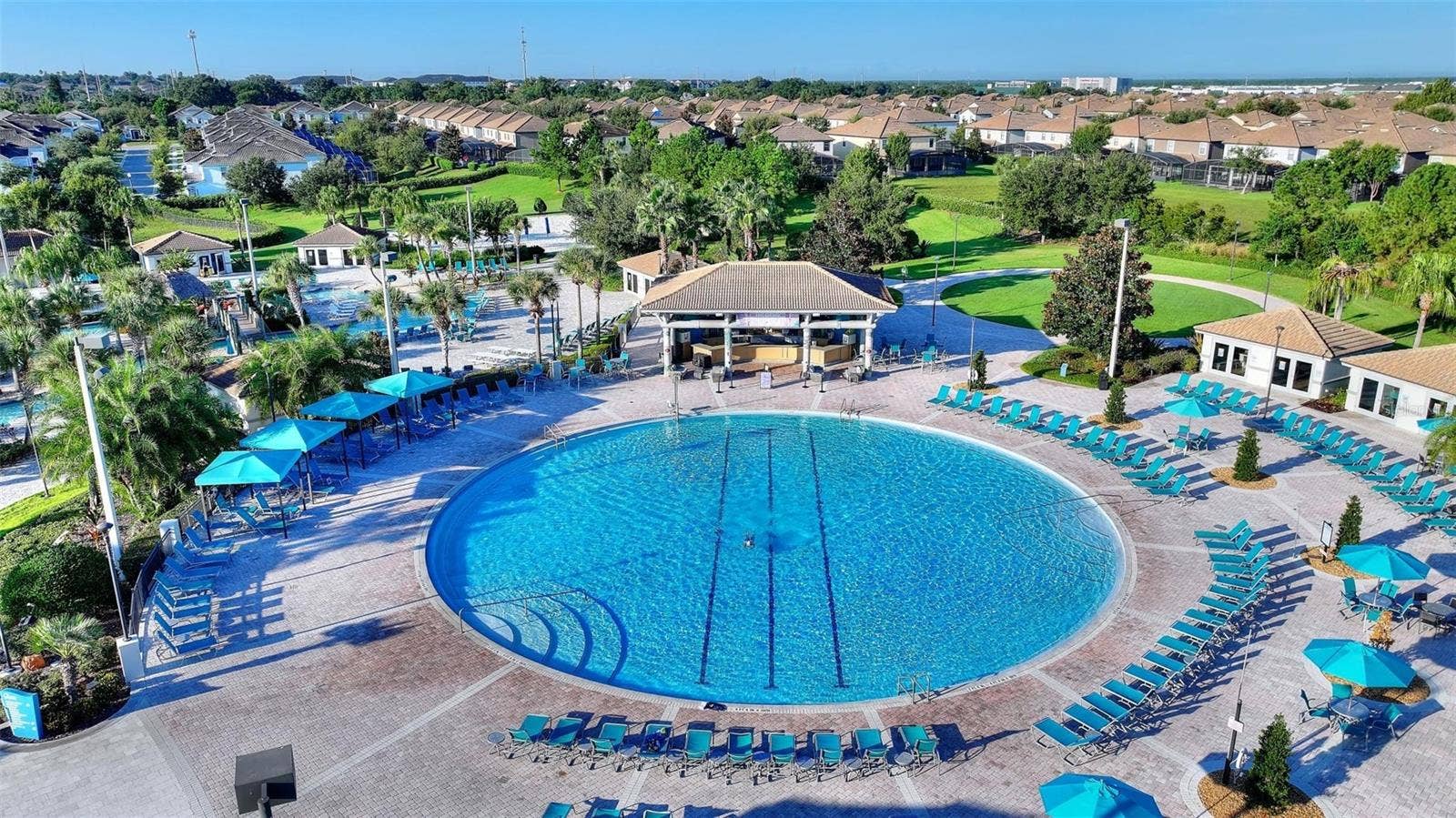 1301 GLENEAGLES LANE, Davenport, FL 33896 Oasis Club adult pool, loungers, Cabanas, and Tiki Bar