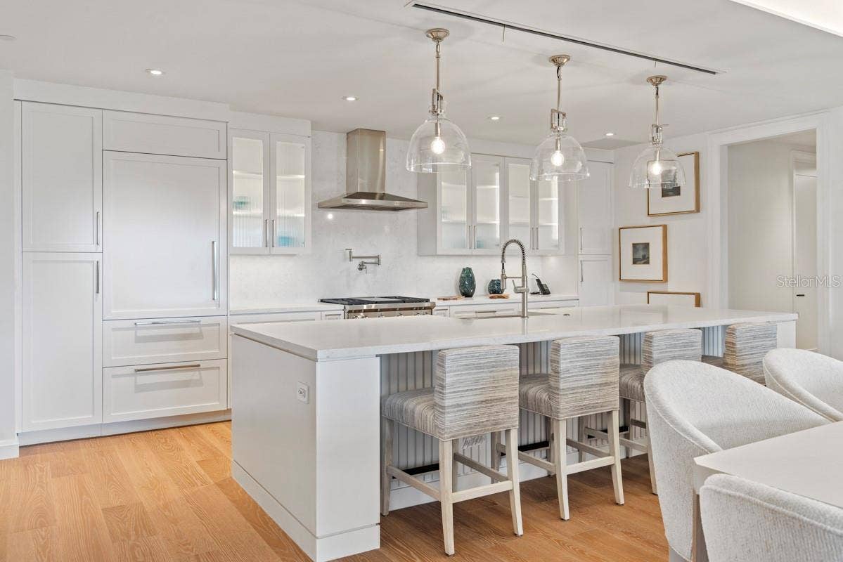 10160 AUTUMN MIST LANE, #402, Orlando, FL 32836 Custom frameless contemporary wood cabinetry with full-extension drawer glides, soft-close drawer and doors, complemented by under-cabinet lighting.