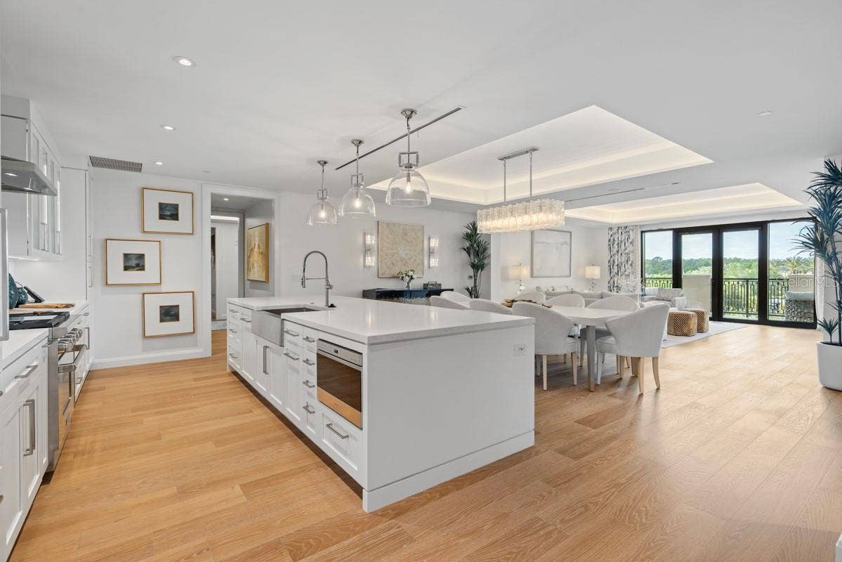 10160 AUTUMN MIST LANE, #402, Orlando, FL 32836 Custom frameless contemporary wood cabinetry with full-extension drawer glides, soft-close drawer and doors, complemented by under-cabinet lighting.