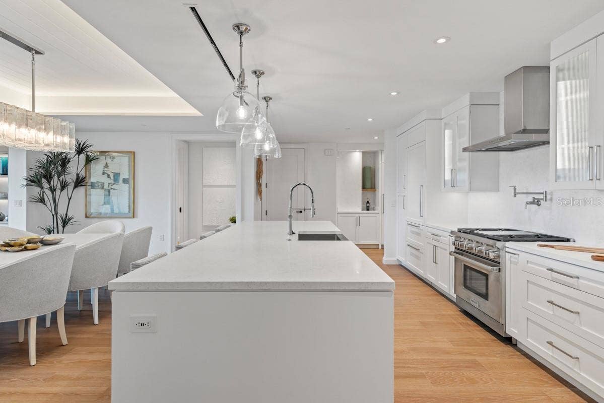 10160 AUTUMN MIST LANE, #402, Orlando, FL 32836 Custom frameless contemporary wood cabinetry with full-extension drawer glides, soft-close drawer and doors, complemented by under-cabinet lighting.