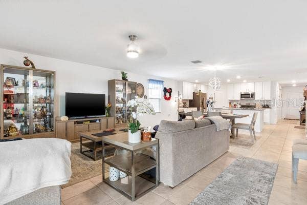 4382 FINCH LANE, Kissimmee, FL 34746 Living, dining and kitchen areas from exit to lanai