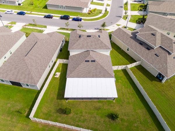 4382 FINCH LANE, Kissimmee, FL 34746 House from rear showing lanai (white) and rear yard (fenced)