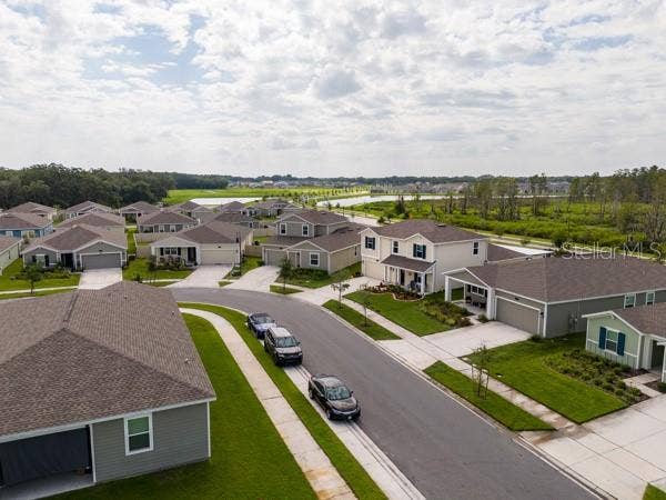 4382 FINCH LANE, Kissimmee, FL 34746 House in context with street