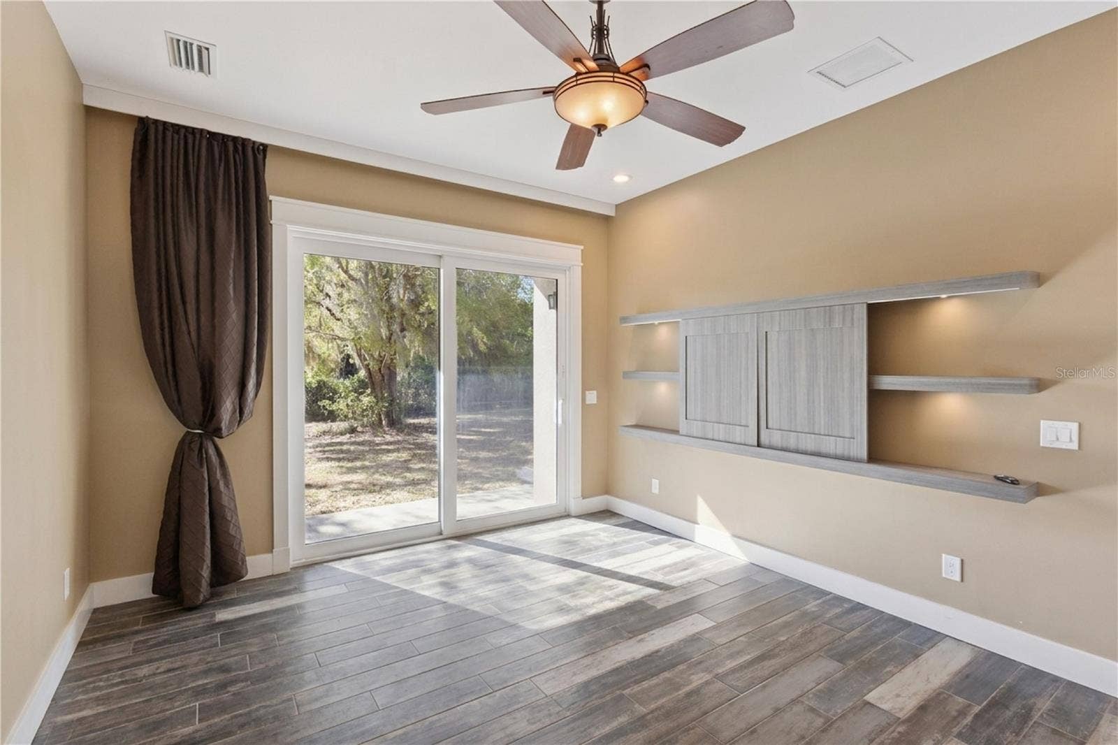 15503 TROTTING HORSE LANE, Tavares, FL 32778 Master Bedroom with custom built in for TV