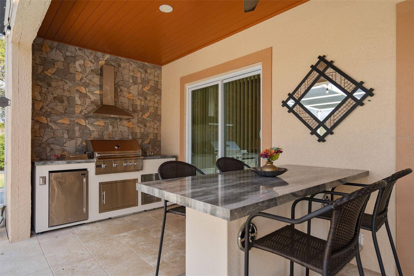 9057 BALMORAL MEWS SQUARE, Windermere, FL 34786 Outdoor Kitchen and outdoor seating with built in speakers