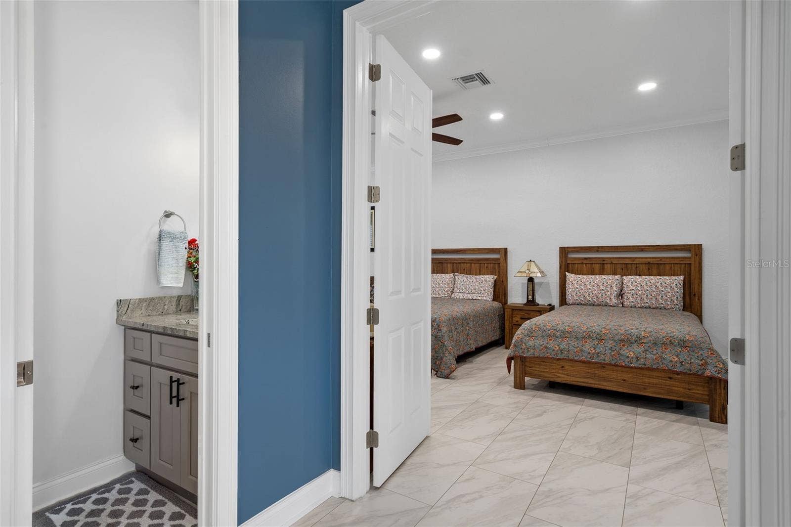 9057 BALMORAL MEWS SQUARE, Windermere, FL 34786 view of the downstairs master suite and downstairs half bathroom