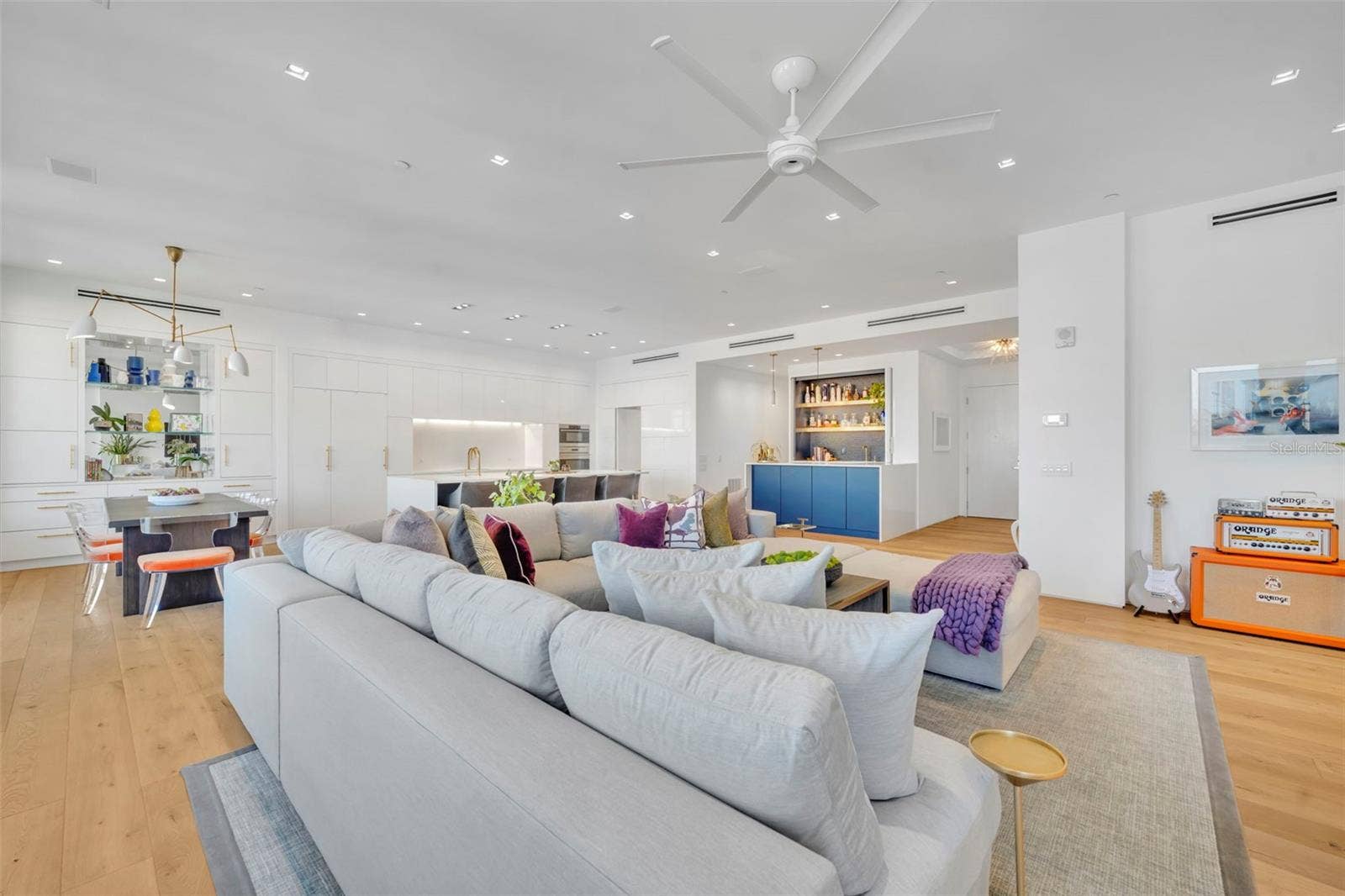Living Room looking to kitchen and bar area