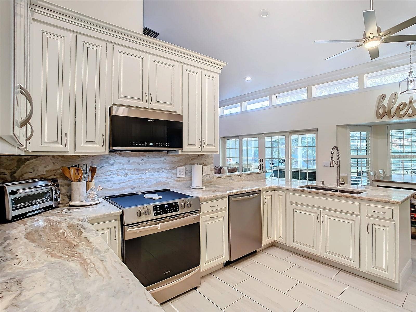 8707 FERNWICKE COURT, Orlando, FL 32819 Custom real wood 42 in cabinets with custom trim molding
