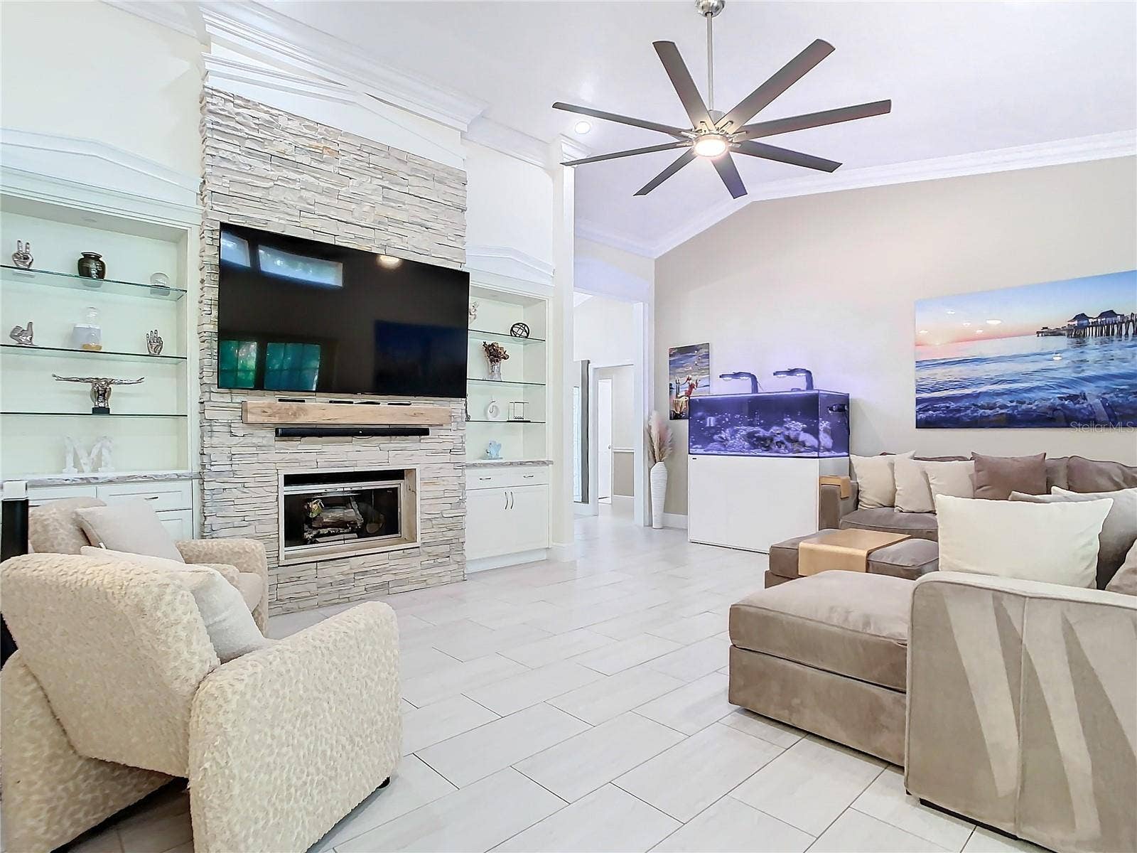 8707 FERNWICKE COURT, Orlando, FL 32819 Wood Burning Fireplace with custom bookcases hugging the center