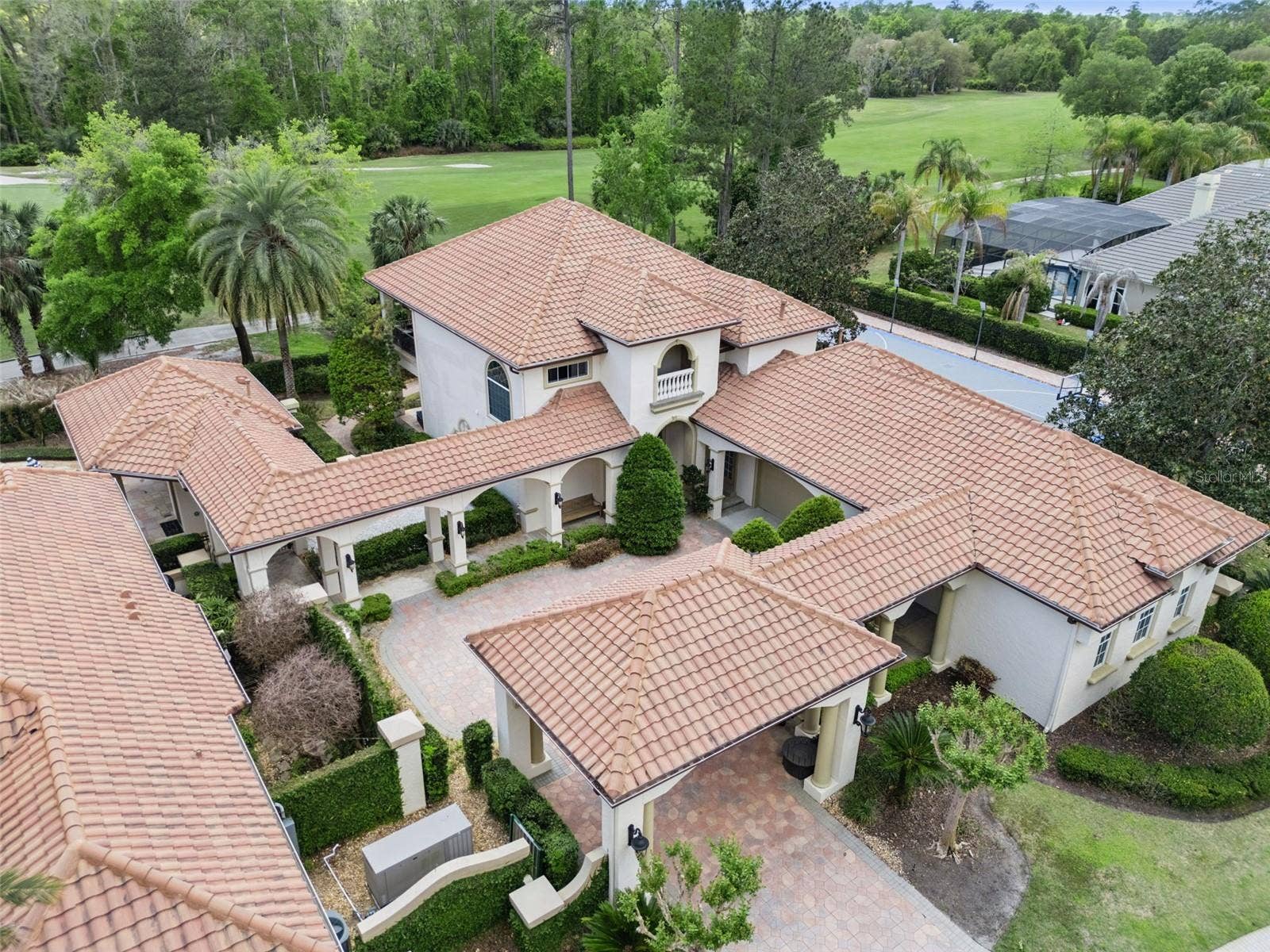 3545 LEGACY HILLS COURT, Longwood, FL 32779 Separate Guest House with a 2 car garage and a golf cart bay with garage door on back side of the garage with a pavered path leading to the golf course.