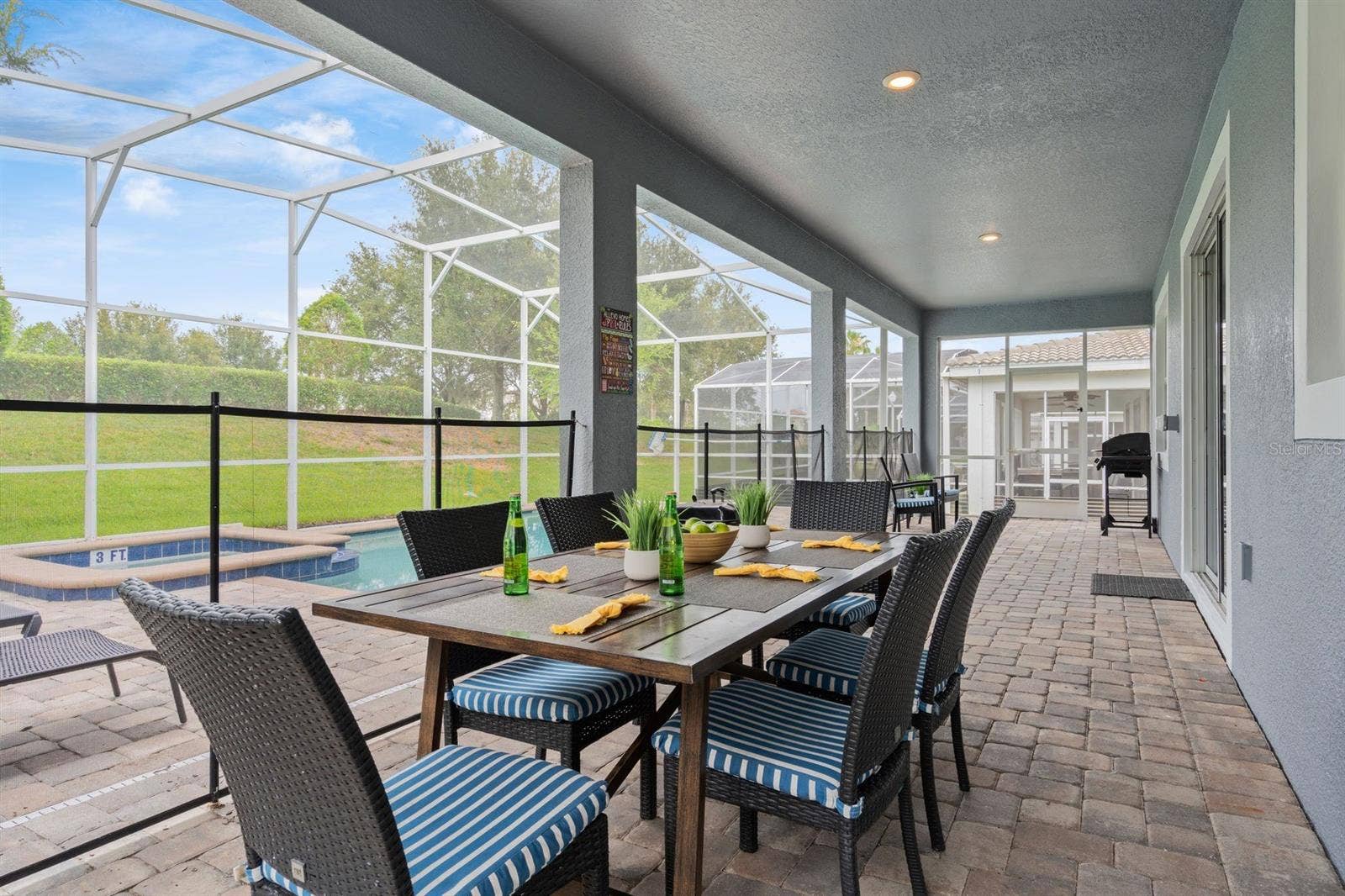 9050 STINGER DRIVE, Davenport, FL 33896 Covered patio and BBQ